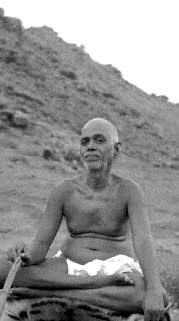 Ramana Maharshi with Arunachala Hill behind